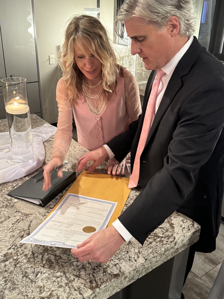 Billy and Kelly officiating a wedding